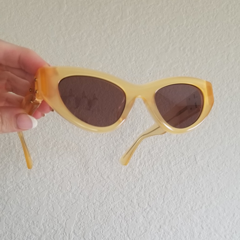 Clear yellow and gold cateye sunglasses